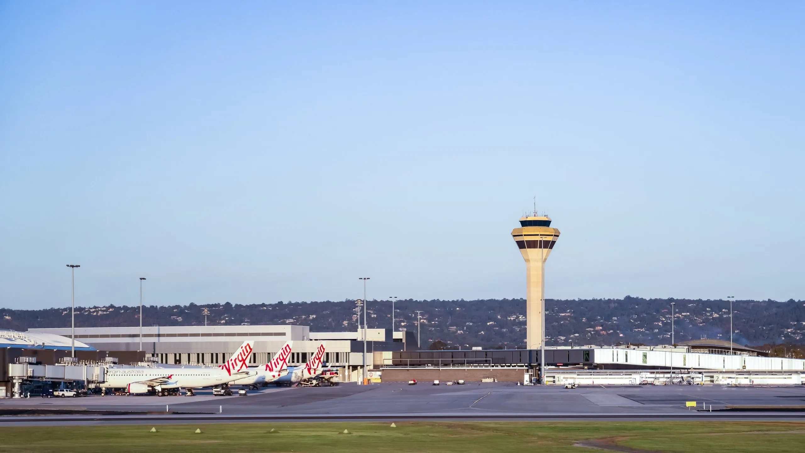 Perth Airport terminal precinct with control tower and aircraft on the apron